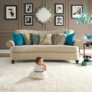 Cute baby sitting on carpet floor |  Gainesville CarpetsPlus COLORTILE