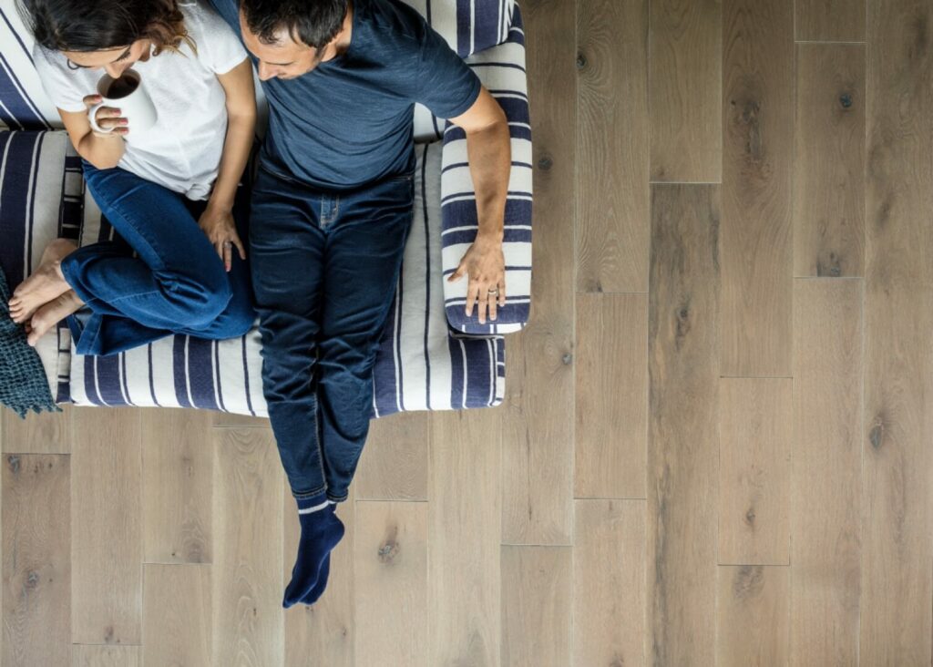 Couple sitting on sofa | Gainesville CarpetsPlus COLORTILE
